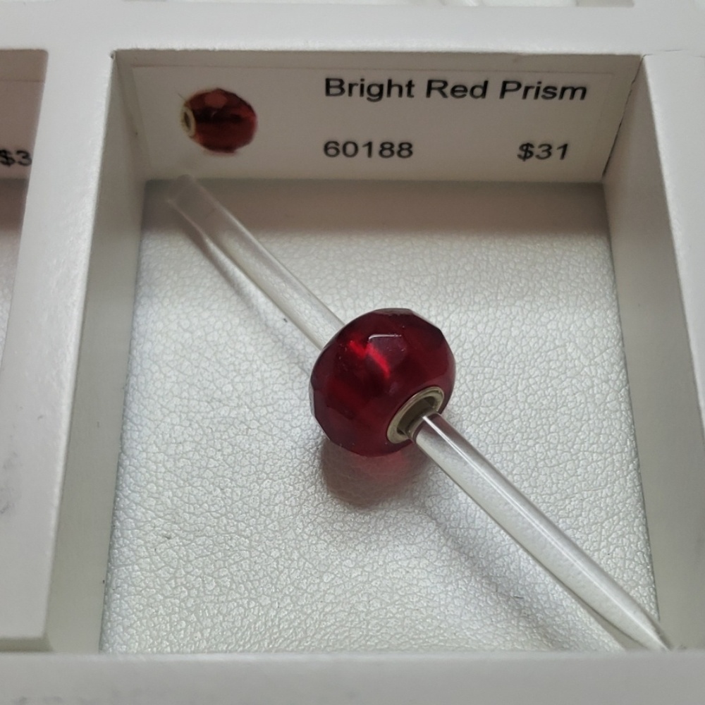 Bright red prism Trollbead with a silver core